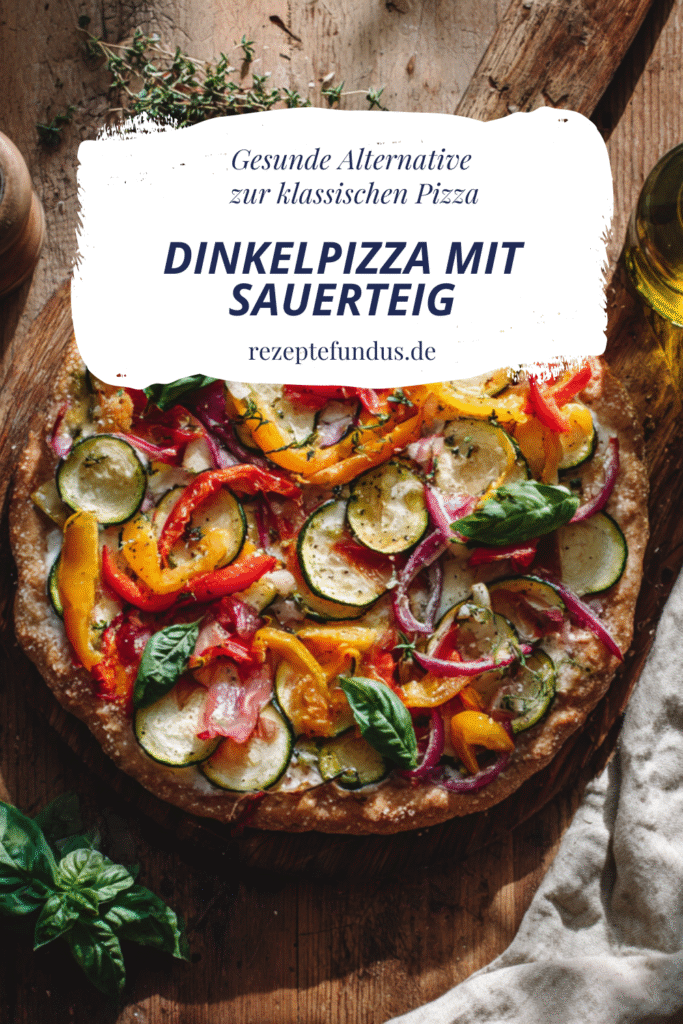 Dinkelpizza mit Sauerteig – dünner, knuspriger Rand, frisch gebacken, belegt mit buntem Gemüse und frischem Basilikum, gesunde Wohlfühlküche ohne Verzicht